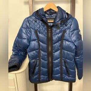 Women’s size small Guess Navy blue Puffer Coat with hood. Logo on left arm.